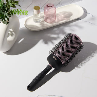 Round brush on vanity. 