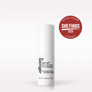 A white cylindrical bottle of Lange Sky Lift Non-Aerosol Dry Shampoo on a clean white background, featuring a red circular 'She Finds 2026 Beauty Awards Winner' badge in the upper right.