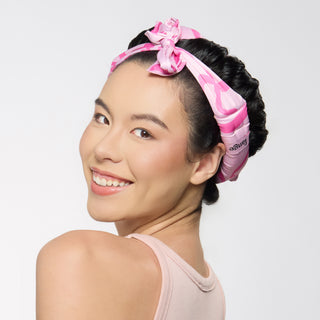 model with satin curling rod on her head