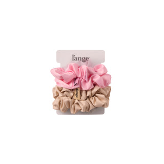 L’ange large satin scrunchies 4-piece set in blush pink and champagne, stacked on a card against a white background.