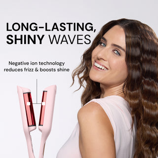 Model with wavy hair smiling beside pink L’ange waver. Text reads: “Long-Lasting, Shiny Waves. Negative ion technology reduces frizz & boosts shine.”