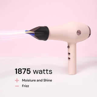 A blush-colored Soleil dryer with the included air concentrator, blows out air with overlay text about its 1875 watt motor