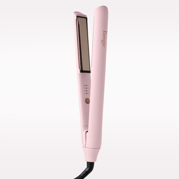 A light pink hair straightener with rose gold-toned plates and a black cord, shown on a clean white background.