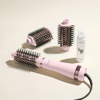 The Switch It Up Value Set, featuring a Blush Multi-Volume Series Brush, 65mm and secondary attachments, and Glass Hair, displayed on a beige background