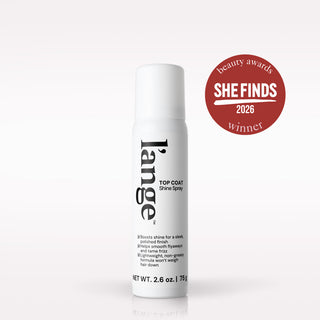 A white aerosol can of Lange Top Coat Shine Spray for hair, shown on a clean white background with a red circular 'She Finds 2026 Beauty Awards Winner' badge to the right.