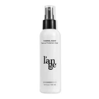 White bottle of L’ange Thermal Agent, a thermal protectant styler, 4 fl oz (118 ml), with a black spray cap.