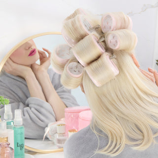 back view of a mode with several pink thermal rollers in her hair