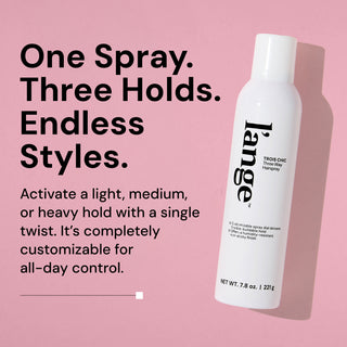 L’ange Trois Chic Three Way Hairspray bottle on a pink background. Text reads: “One Spray. Three Holds. Endless Styles.” “Activate a light, medium, or heavy hold with a single twist. It’s completely customizable for all-day control.” 