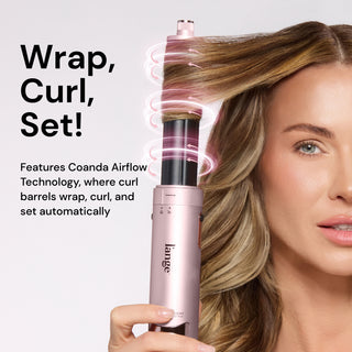 Model using tool while hair wraps around barrel. Text: "Wrap, Curl, Set!" "Features Coanda Airflow Technology, where curl barrels wrap, curl, and set automatically".