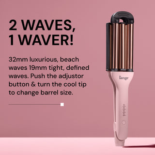 L’ange VersaWaver styling tool with dual barrel sizes standing upright on a pink background. Bold black text reads: ‘2 Waves, 1 Waver!’ Subheading describes: ‘32mm luxurious, beach waves; 19mm tight, defined waves. Push the adjustor button & turn the cool tip to change barrel size.