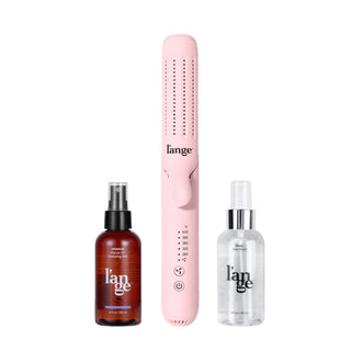 Pink hair styling tool with adjustable temperature settings, accompanied by marula oil hydrating mist and heat shield spray, all branded with "l'ange".