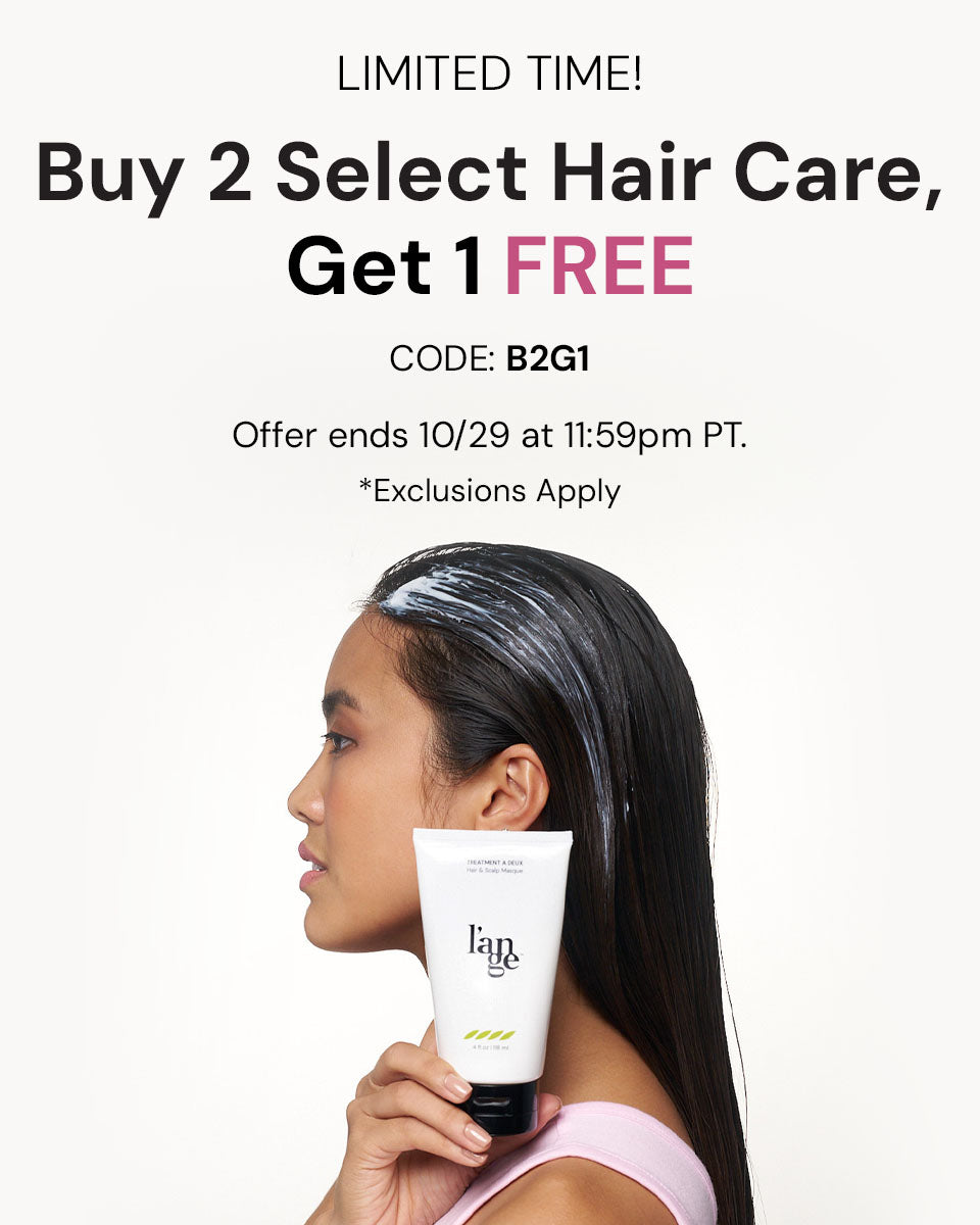 Woman with hair treatment applied holds a bottle of l’ange product; promotional text details a buy two, get one free offer with code B2G1, ending on October 29 at 11:59 PM PT, with exclusions.