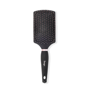 The black Siena Paddle Brush stands vertically so you can clearly see the rectangular shape.