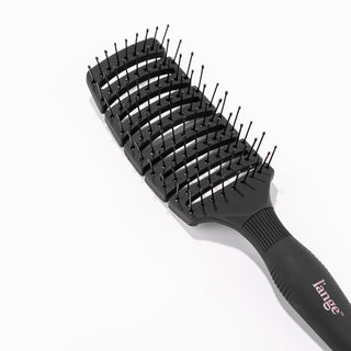 The curved design of the black vent brush shows its flexibility & gaps for airflow when drying.
