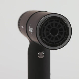 Video of slim black t-shape hair dryer with heat, speed, power buttons with silver L'ange logo