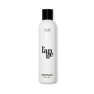 White 8fl oz bottle with Curl Care Shampoo and L’ange logo in black font and black tap