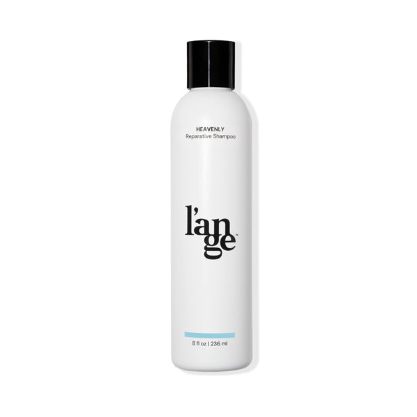 White 8 oz bottle with black font Heavenly Reparative Shampoo, black L’ange logo & black cover
