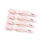 Four pink alligator hair clips are lined up side-by-side, displaying the logo and easy grips.