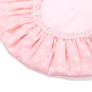 A quarter of the reversible shower cap is visible so you see a close-up of the inside and outside.