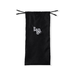 The standard black hair tool bag is laid out flat so you can see its length, logo, and drawstrings.