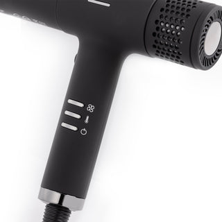 Zoomed in view of black hair dryer handle with speed, temperature and power buttons