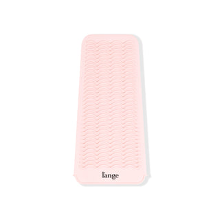 You can see the rippled, slip-resistant, silicone surface of the curling iron mat for hot tools.