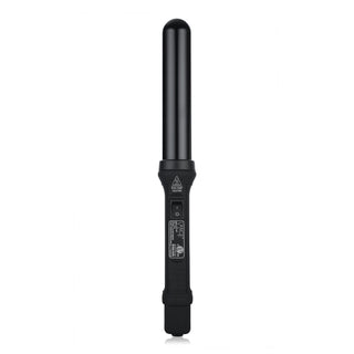 A sleek black curling wand with a cylindrical barrel, featuring an on/off switch and safety caution label on the handle.